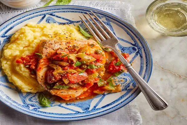 Swordfish with Olives, Capers & Tomatoes over Polenta