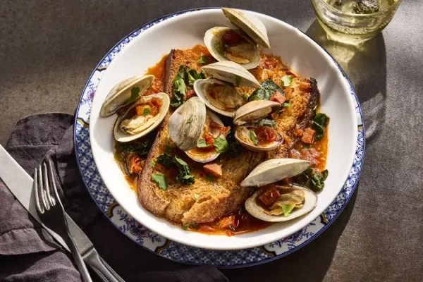 Clams with Kale and Chouriço on Toasts